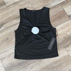 Emerson Lang Young Contemporary black top with a striking white rosette